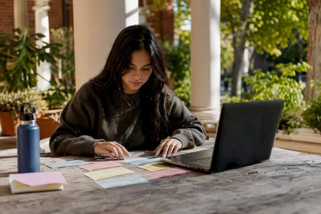 Student arranging semester schedule cards