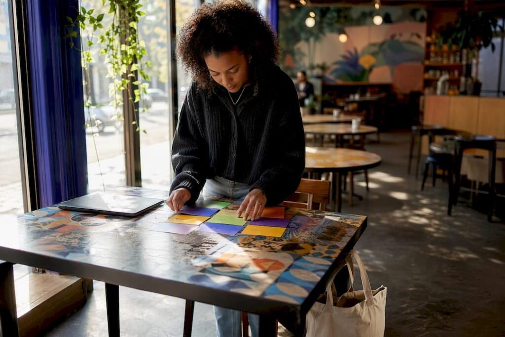 Student arranging semester credit cards on table