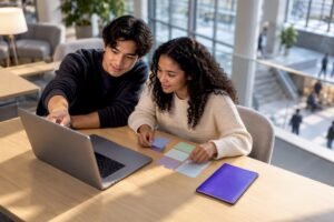 Students planning courses on a laptop