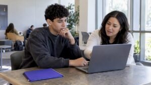Student comparing degree planning options with advisor