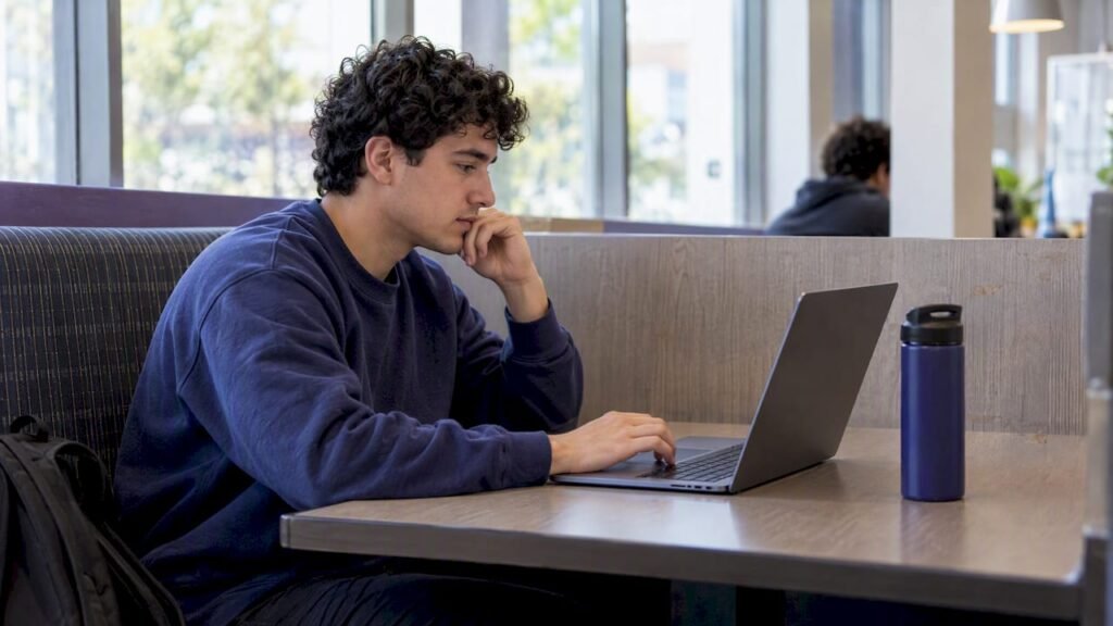 Student comparing course options on laptop