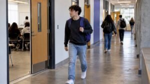 Student walking between consecutive lecture rooms